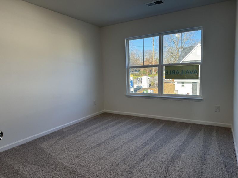 Spacious, unfurnished interior of a new home in East Main Townes, Spartanburg (Image 12).