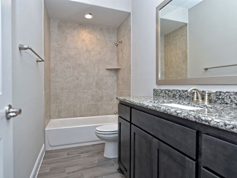 Representative furnished interior of a home built from the San Simeon I by Giddens Homes in Clearwater Ranch, Liberty Hill (Image 285).
