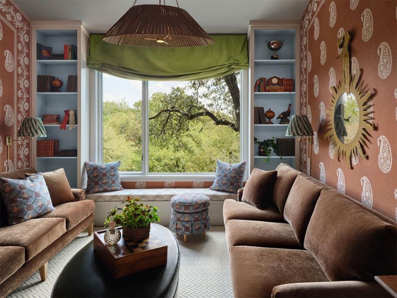 The window seat offers a perfect place to cozy up with a book and take in the treetop views.