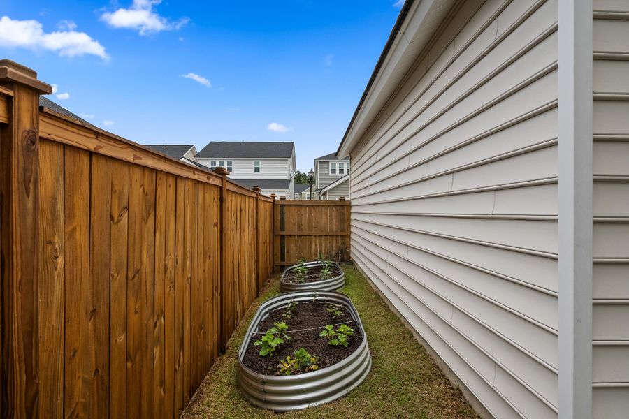 Exterior details and patio area of a home in Sweetgrass at Summers Corner, Summerville (Image 4).