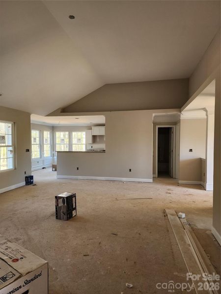 Living Room w/ Plant Shelf Above, Open to Kitchen