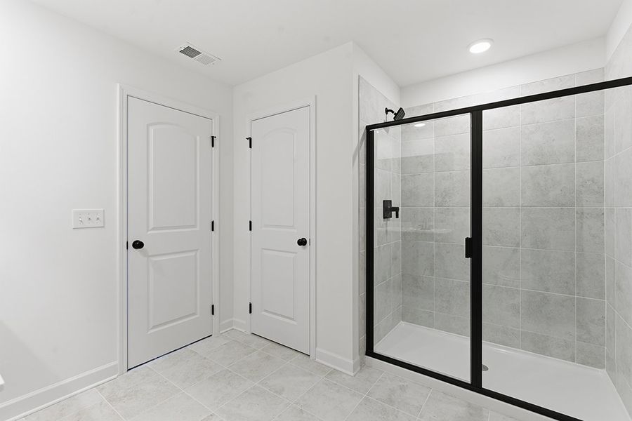 A bathroom with a glass shower.