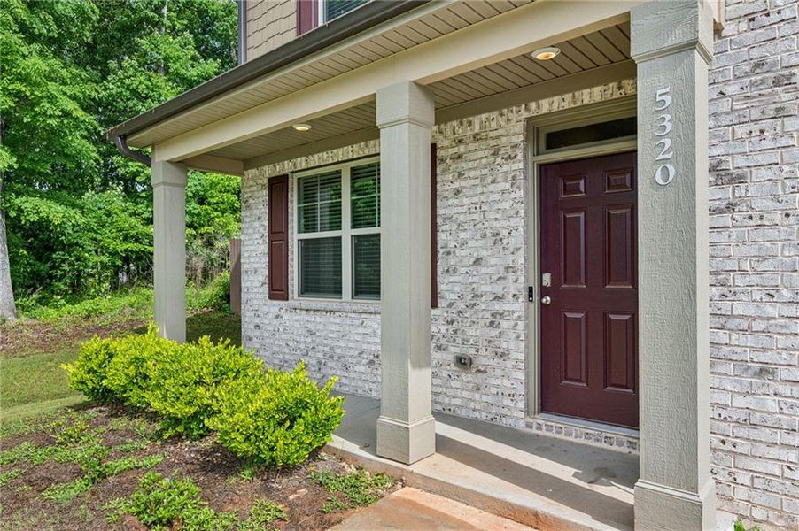 Front exterior of a new home in The Enclave at Flat Rock Hills, Stonecrest, GA, highlighting curb appeal (Image 21).