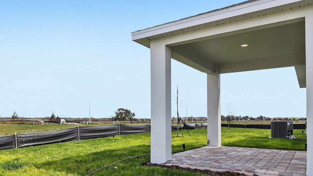 Representative exterior photo of a completed home built from the Castaway Multi-Gen by DRB Homes in Hamilton Bluff, Haines City, FL (Image 25).