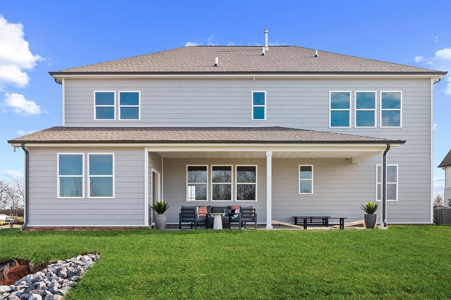 A house with a lawn in front.