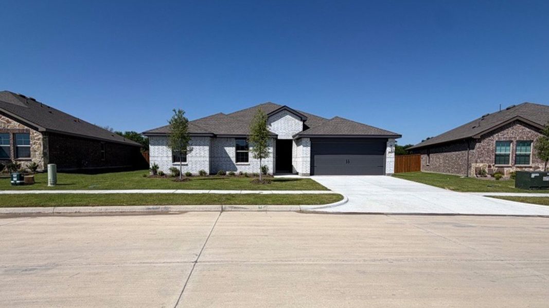 Front exterior of a new home in Northspur, Terrell, TX, highlighting curb appeal (Image 15). Front exterior of a new home in Northspur, Terrell, TX, highlighting curb appeal (Image 15).