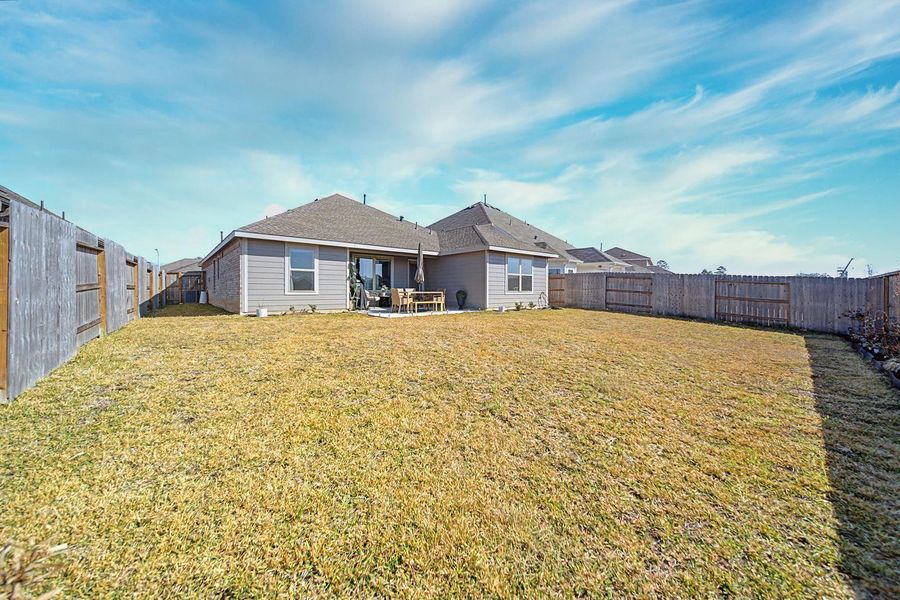 Exterior details and patio area of a home in Pinewood at Grand Texas, New Caney (Image 4).