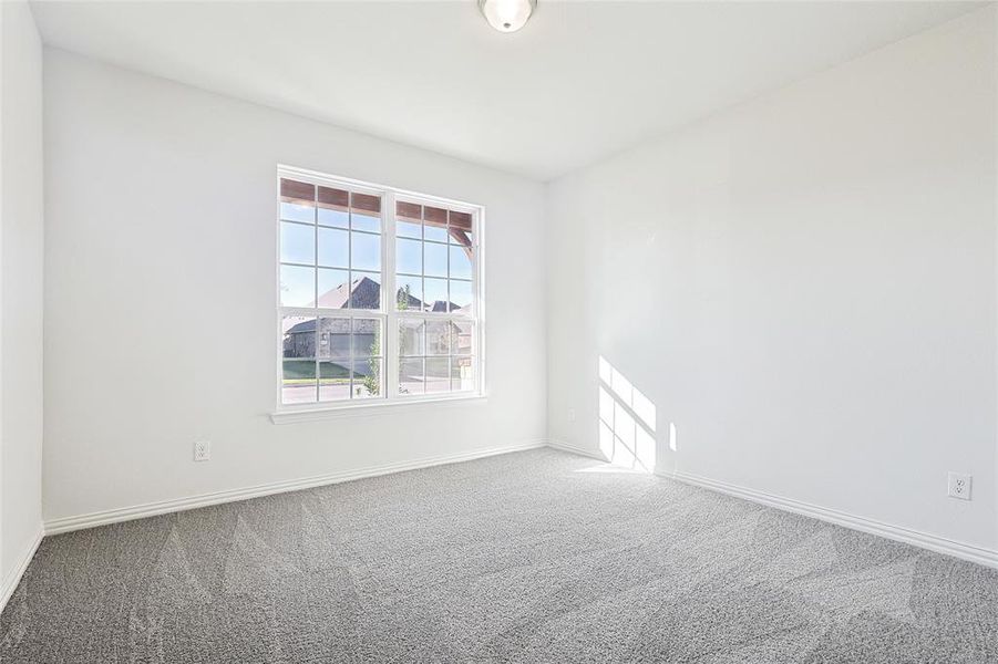 Empty room featuring carpet floors and baseboards Empty room featuring carpet floors and baseboards
