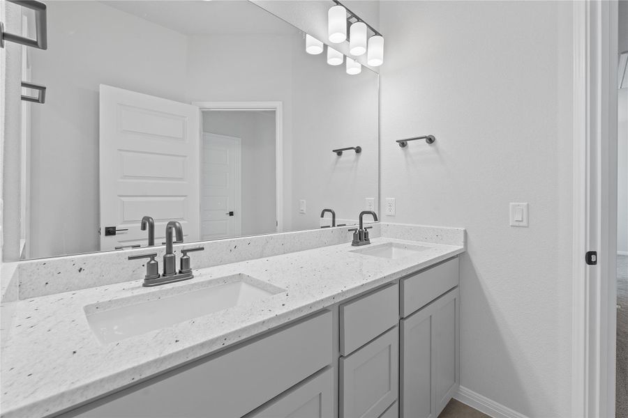 Bathroom featuring double vanity
