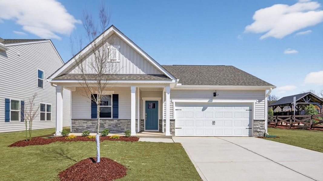 Front exterior of a new home in Tyler - Home on the Lake, New Bern, NC, highlighting curb appeal (Image 1). Front exterior of a new home in Tyler - Home on the Lake, New Bern, NC, highlighting curb appeal (Image 1).