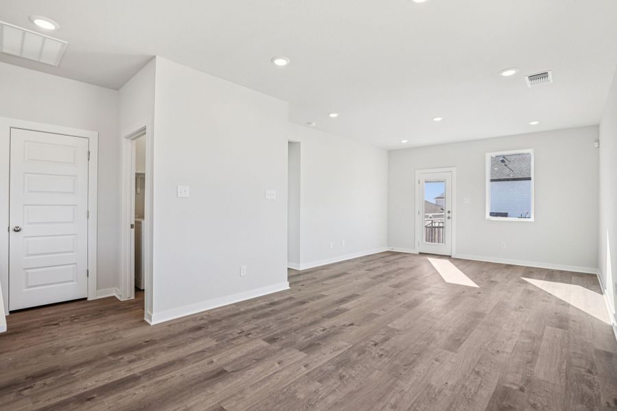 A room with white walls and wood floors. A room with white walls and wood floors.