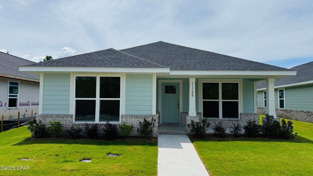 Front exterior of a new home in East Bay, Panama City, FL, highlighting curb appeal (Image 1).