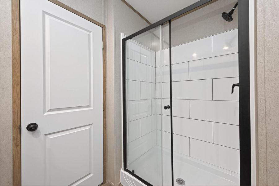 View highlighting the separate walk-in shower. View highlighting the separate walk-in shower.