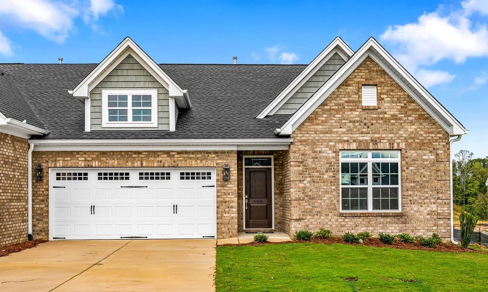 Front exterior of a new home in Fieldstone, Lexington, NC, highlighting curb appeal (Image 1).