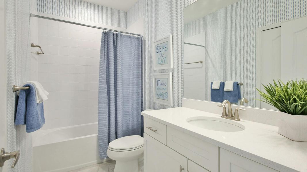 Furnished interior view inside a new home in Palm Grove Real Estate and Homes for Sale in Lakewood Ranch, FL - Neal Communities, Lakewood Ranch (Image 32).