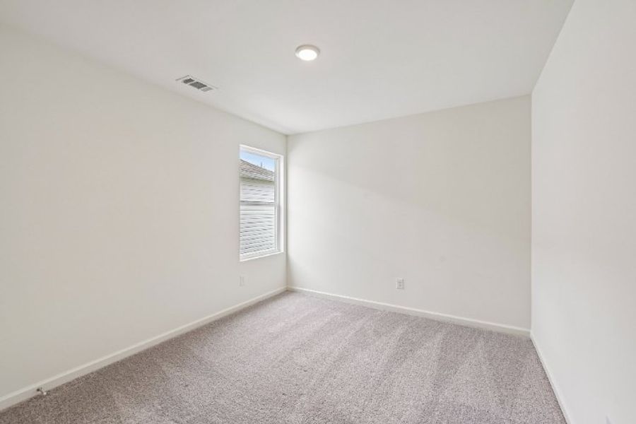 A hallway with a carpet. A hallway with a carpet.