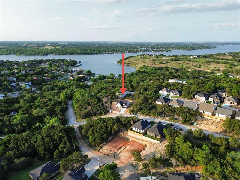 View of property location featuring nearby suburban area and a large body of water View of property location featuring nearby suburban area and a large body of water
