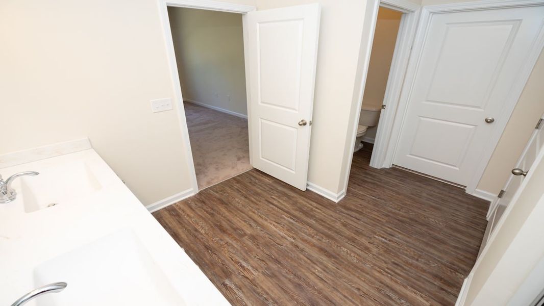 Representative unfurnished interior of a home built from the CALI by D.R. Horton in The Reserve at Wild Horse, Conway (Image 31).
