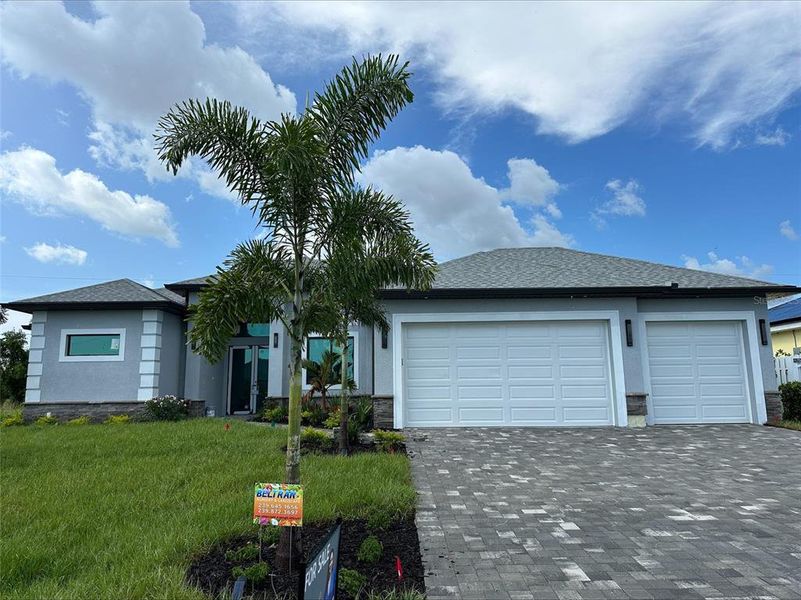 Front exterior of a new home in , Cape Coral, FL, highlighting curb appeal (Image 1).