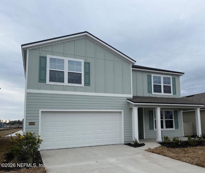 Front exterior of a new home in The Arbors, Jacksonville, FL, highlighting curb appeal (Image 2). Front exterior of a new home in The Arbors, Jacksonville, FL, highlighting curb appeal (Image 2).