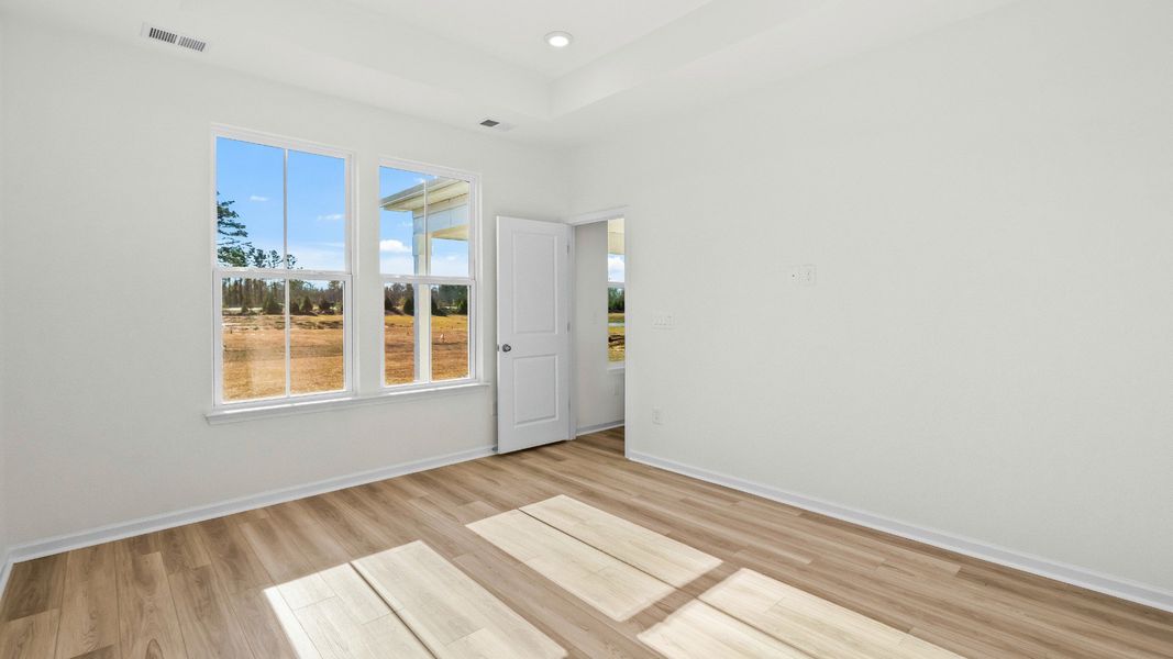 Relaxed, light-filled primary bedroom offering thoughtful Easton design Relaxed, light-filled primary bedroom offering thoughtful Easton design