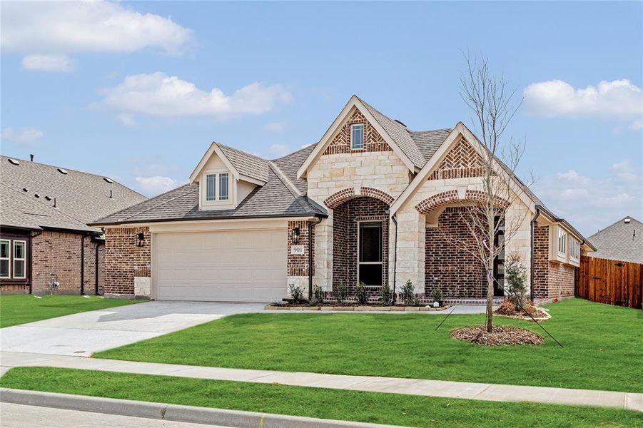 Front exterior of a new home in West Crossing, Anna, TX, highlighting curb appeal (Image 1).