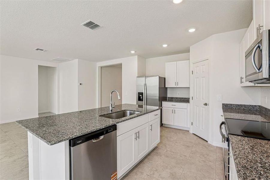 Furnished interior view inside a new home in Lawson Dunes - Signature Series, Haines City (Image 18). Furnished interior view inside a new home in Lawson Dunes - Signature Series, Haines City (Image 18).