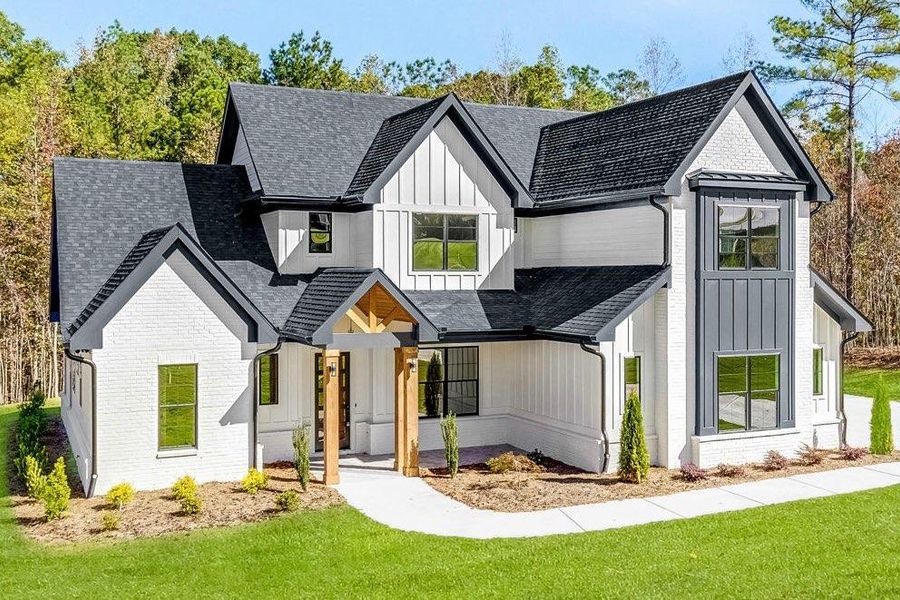 Front exterior of a new home in , Newnan, GA, highlighting curb appeal (Image 26). Front exterior of a new home in , Newnan, GA, highlighting curb appeal (Image 26).