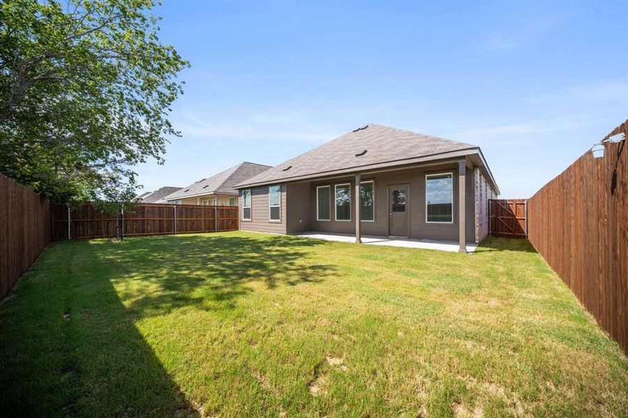 Exterior details and patio area of a home in Prairie View, Ennis (Image 4). Exterior details and patio area of a home in Prairie View, Ennis (Image 4).