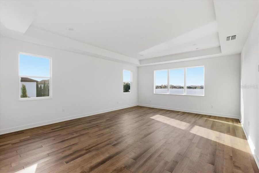 Spacious, unfurnished interior of a new home in Shorefront Cove, Winter Garden (Image 12).