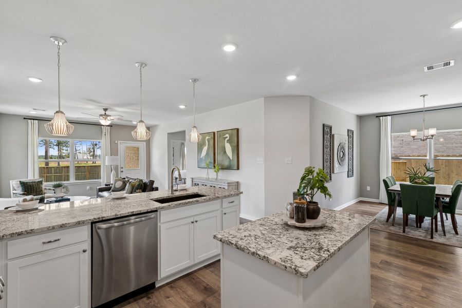 The Sparrow II- Kitchen into Dining and Family Room The Sparrow II- Kitchen into Dining and Family Room