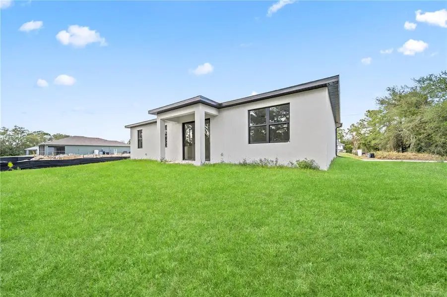 Exterior details and patio area of a home in , Lehigh Acres (Image 3).