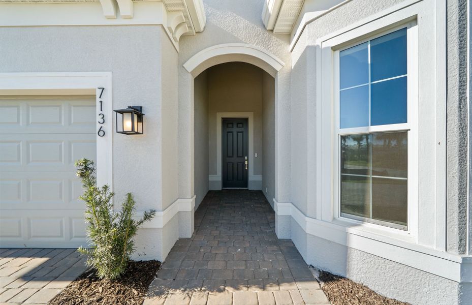 Exterior details and patio area of a home in Del Webb Oak Creek, North Fort Myers (Image 3).