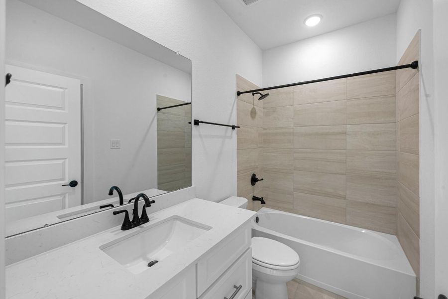 Furnished interior view inside a new home in Bridgeland, Cypress (Image 10).