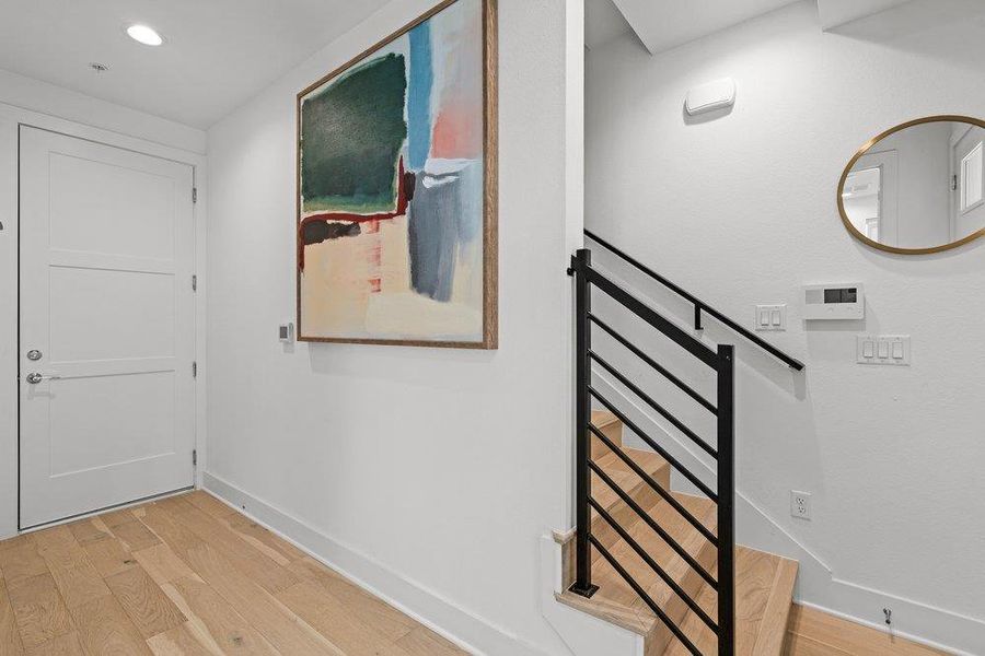 Clean lines and light wood flooring define this inviting entryway. Clean lines and light wood flooring define this inviting entryway.