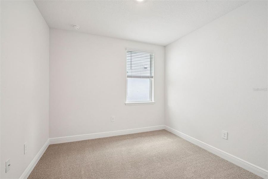 Spacious, unfurnished interior of a new home in The Reserve at Hammock Oaks - Signature Series, Lady Lake (Image 27).