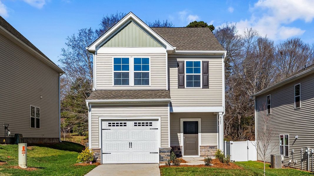 Front exterior of a new home in Hanes Lake, Winston-Salem, NC, highlighting curb appeal (Image 1).