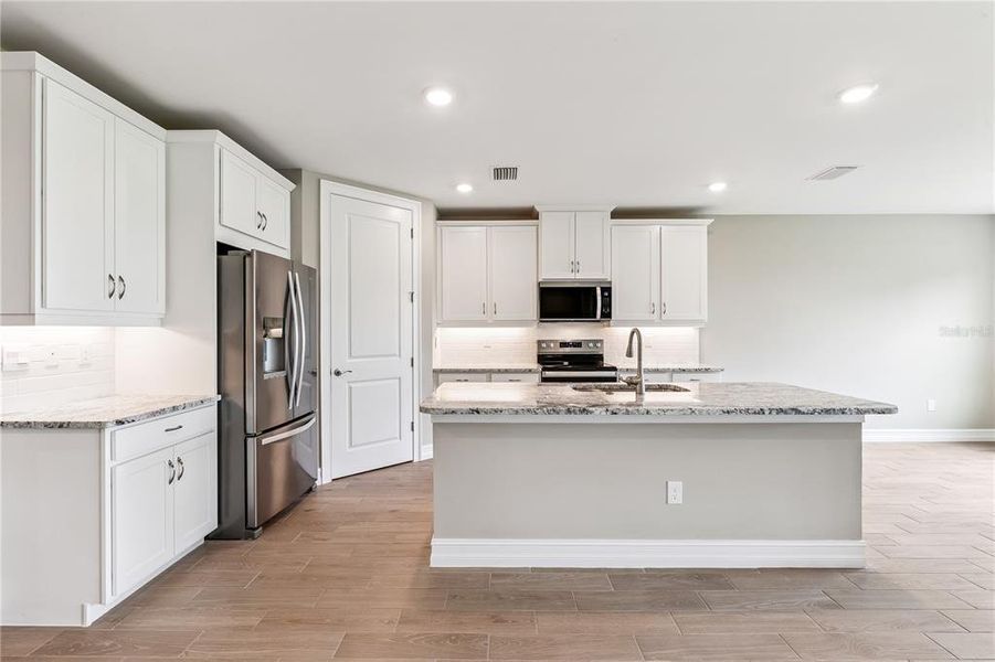 Furnished interior view inside a new home in Burnt Store Village, Punta Gorda (Image 5).