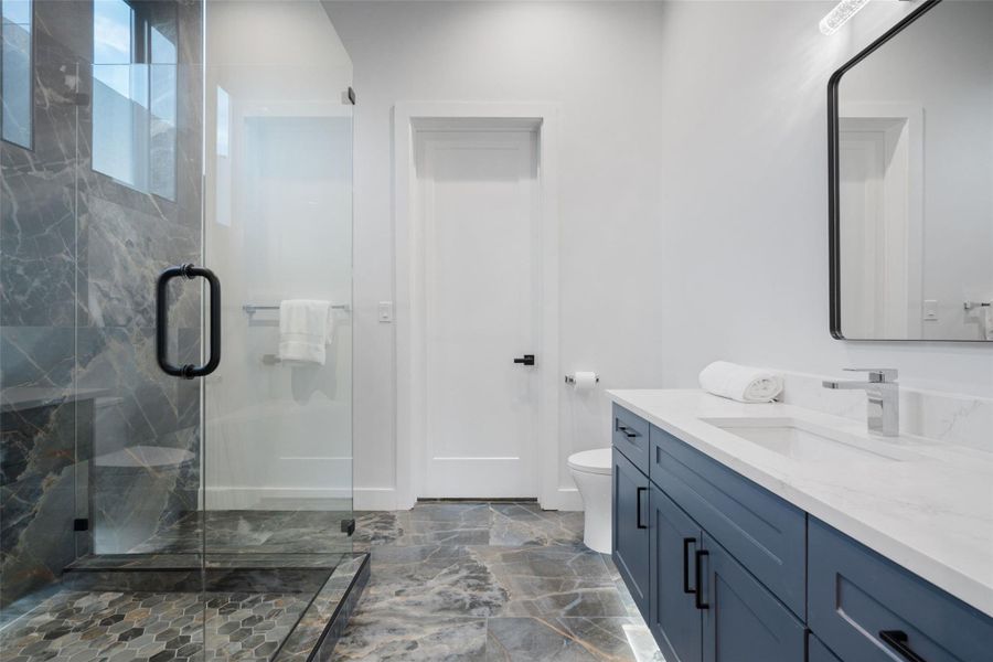 . Three additional ensuite bedrooms provide generous accommodations for family and guests alike.