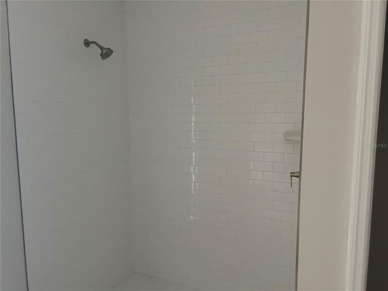 In-progress construction of a new home in Oakfield Trails Signature, Parrish, FL (Image 23).