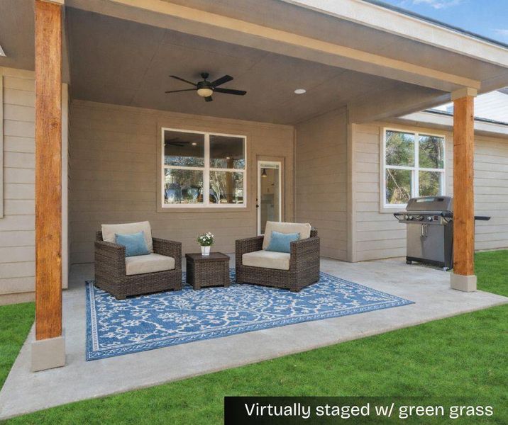Virtually staged covered patio with green color added to the grass