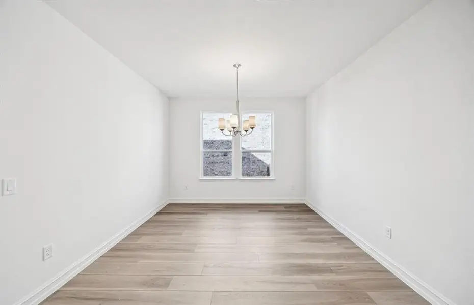 Formal dining room with large windows Formal dining room with large windows