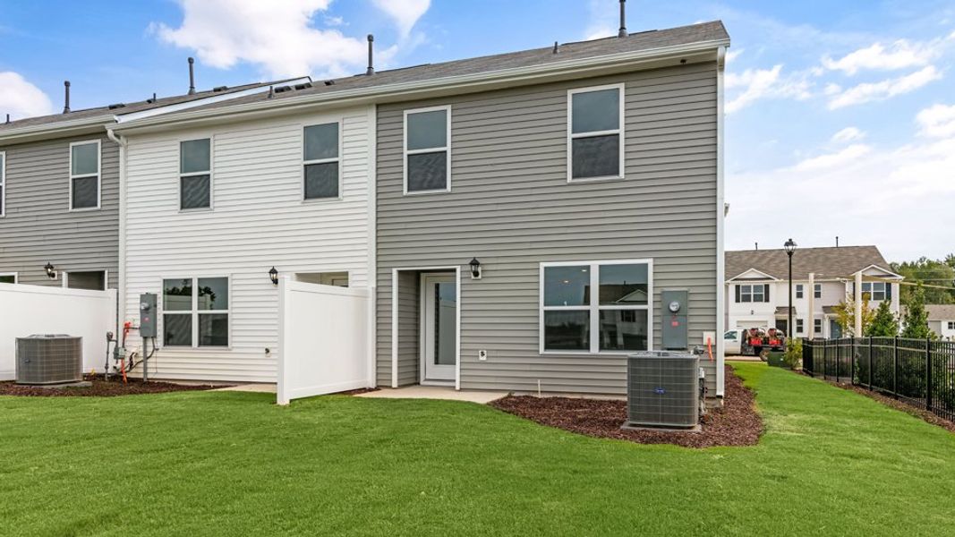 Exterior details and patio area of a home in The Townes at Hunter Hill, Rocky Mount (Image 25).