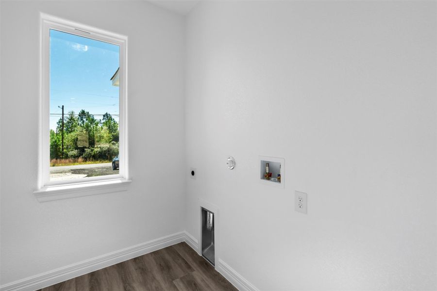 Washroom featuring dark wood finished floors, gas dryer hookup, hookup for a washing machine, and electric dryer hookup