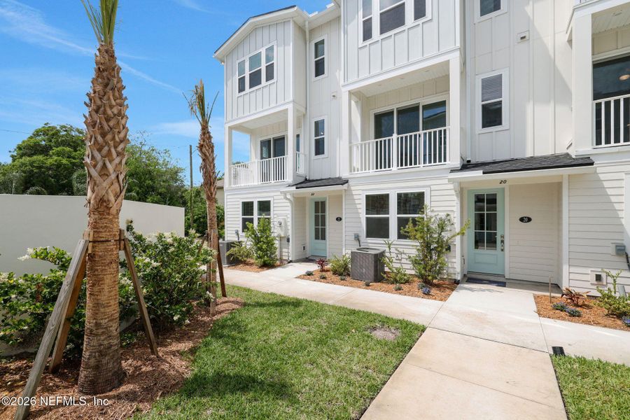 Exterior details and patio area of a home in North Beach Townhomes, Jacksonville Beach (Image 3).
