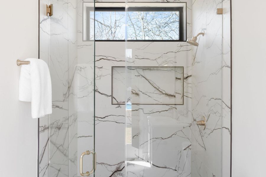 Full bathroom featuring a marble finish shower