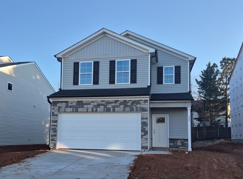 Front exterior of a new home in Bell West, Kernersville, NC, highlighting curb appeal (Image 1).