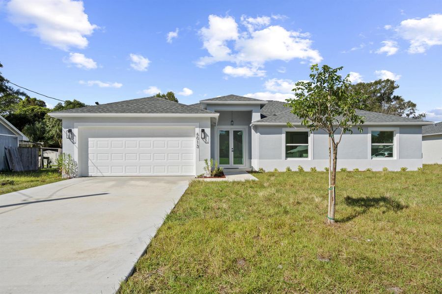 Front exterior of a new home in , Fort Pierce, FL, highlighting curb appeal (Image 22). Front exterior of a new home in , Fort Pierce, FL, highlighting curb appeal (Image 22).