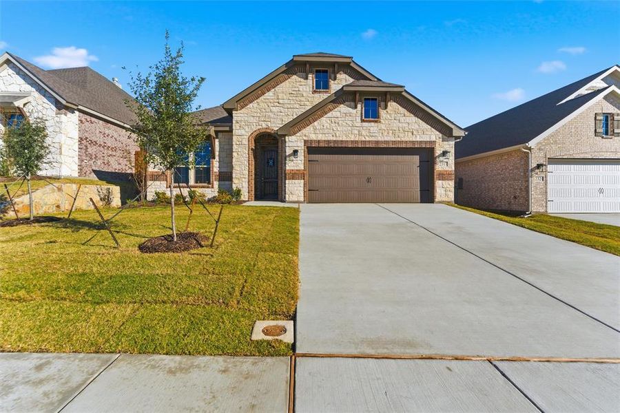 Front exterior of a new home in Waterford Park, Weatherford, TX, highlighting curb appeal (Image 2). Front exterior of a new home in Waterford Park, Weatherford, TX, highlighting curb appeal (Image 2).