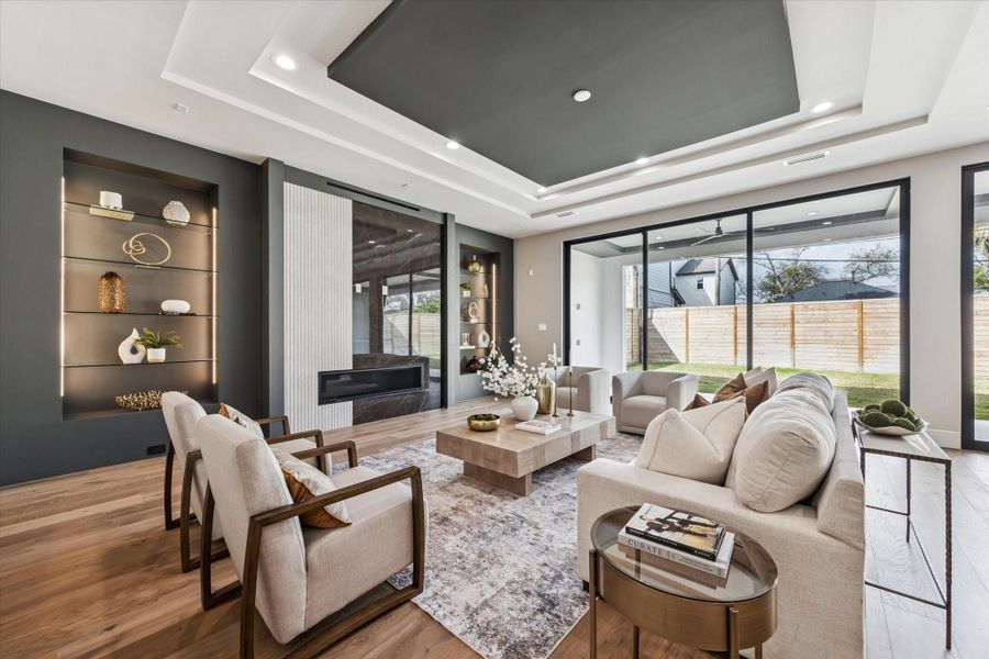 A close-up view of the living room highlights the intricate ceiling detail, adding architectural interest and elegance to the space.